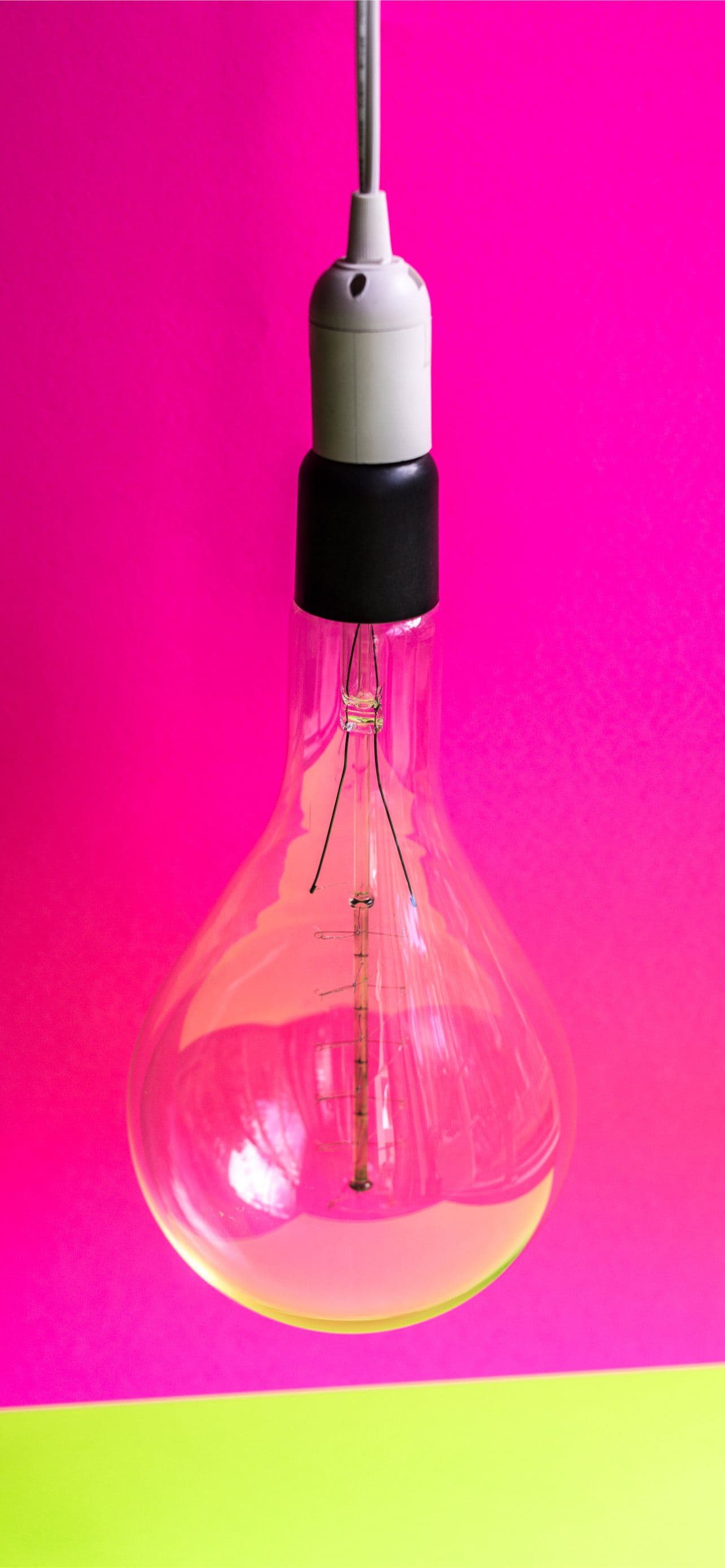 Close Up Photo Of Light Bulb With Pink Background